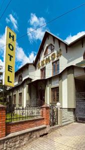 a building with a hotel sign in front of it at Lemon in Drogobych