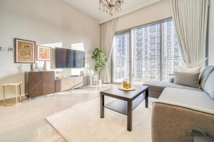 Posezení v ubytování Graceful 1BR at Park Heights Dubai Hills MBR City by Deluxe Holiday Homes