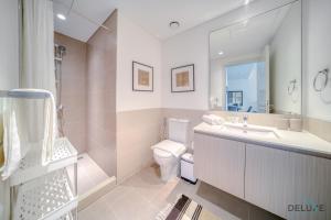 Koupelna v ubytování Graceful 1BR at Park Heights Dubai Hills MBR City by Deluxe Holiday Homes