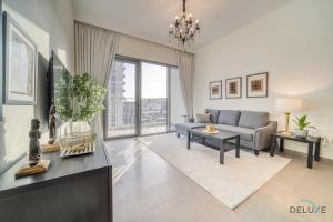Posezení v ubytování Graceful 1BR at Park Heights Dubai Hills MBR City by Deluxe Holiday Homes