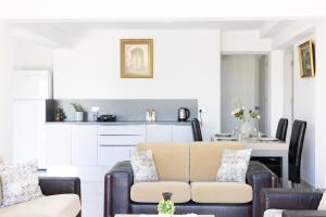 a living room with a couch and a table at Bellapais Apartments in Kyrenia