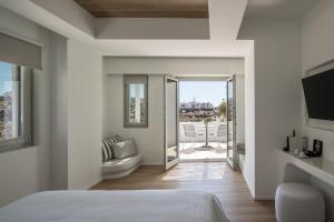 Postel nebo postele na pokoji v ubytování Arocaria Mykonos