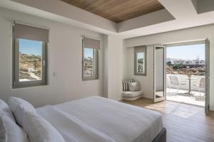 Postel nebo postele na pokoji v ubytování Arocaria Mykonos