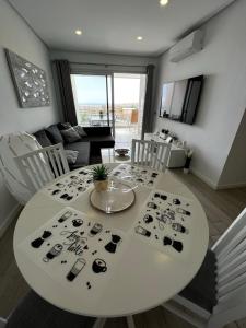 A seating area at Ocean Garden Sunset Apartment - heated swimming pool Free WIFI