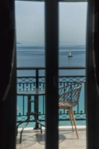 a view of the ocean from a window at Stellatos House in Póros Kefalonias