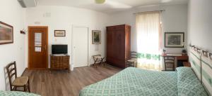 TV a/nebo společenská místnost v ubytování Su Corittu Guesthouse