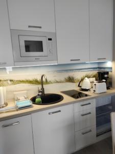 Kuchnia lub aneks kuchenny w obiekcie Apartament z aneksem kuchennym i basenem 426 Diune Hotel Resort