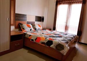 Un ou plusieurs lits dans un hébergement de l'établissement JOBO Guest House 4BR