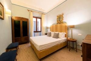 Posteľ alebo postele v izbe v ubytovaní Apartments Florence- Palazzo Pitti