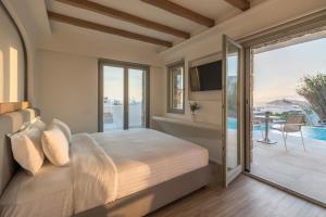 Postel nebo postele na pokoji v ubytování Arocaria Mykonos + 37 fotografií