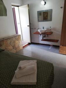 Postel nebo postele na pokoji v ubytování Hotel Villaggio Tabù