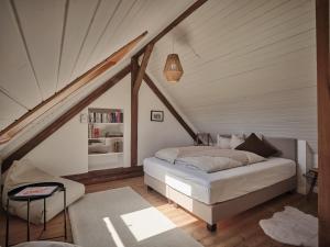 a bedroom with a bed in a attic at Aigen 13 in Aigen