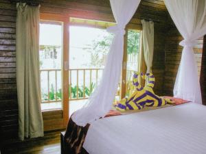 Letto o letti in una camera di Dmas Huts Lembongan