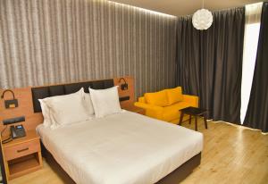 Postel nebo postele na pokoji v ubytování Surf One Hotel