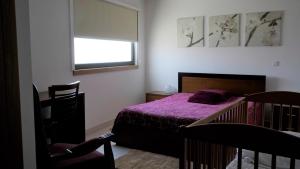 Uma cama ou camas num quarto em Casas do Aidro