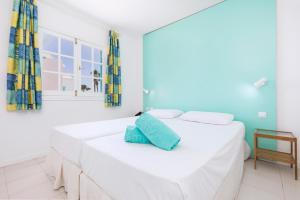 Tempat tidur dalam kamar di Smy Tahona Fuerteventura