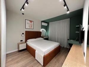 Ένα ή περισσότερα κρεβάτια σε δωμάτιο στο Dolce far niente Apartment