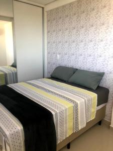 a bedroom with a large bed in a room at Flat com vista perfeita e área completa de lazer! in João Pessoa