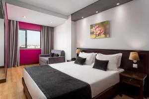 Un pat sau paturi într-o cameră la Hotel Luena