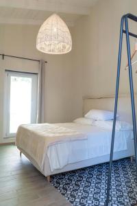 Posteľ alebo postele v izbe v ubytovaní Tesoro Nascosto B&B