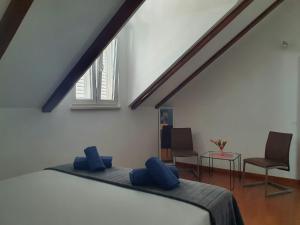 Postel nebo postele na pokoji v ubytování Villa Rita