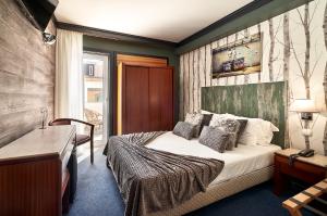 Postel nebo postele na pokoji v ubytování Galeria Suite Hotel