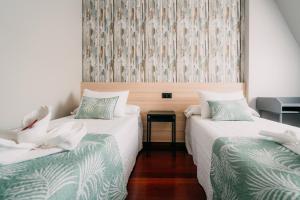 Cama o camas de una habitación en PENSIÓN CALDEA