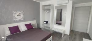 Ένα ή περισσότερα κρεβάτια σε δωμάτιο στο AleVa b&b