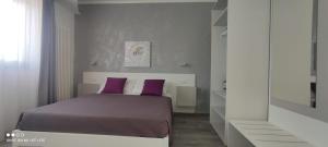 Ένα ή περισσότερα κρεβάτια σε δωμάτιο στο AleVa b&b