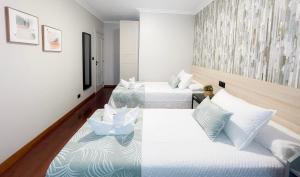 Cama o camas de una habitación en PENSIÓN CALDEA