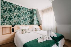 Cama o camas de una habitación en PENSIÓN CALDEA