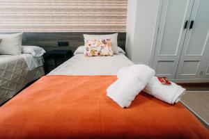 Cama o camas de una habitación en PENSIÓN CALDEA