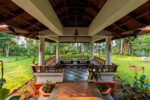 an image of the front porch of a house at SaffronStays WellBeingVilla, Wayanad in Vythiri