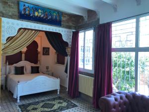 Ένα ή περισσότερα κρεβάτια σε δωμάτιο στο Malabata Guest House
