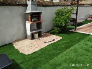 Vonkajšia záhrada v ubytovaní Casa Santa María 2 con jardín y barbacoa