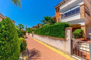 a brick sidewalk in front of a house at HE ZENIAMAR X in Alicante