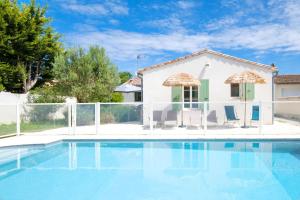 a villa with a swimming pool and a house at "MORANDE" grande maison avec Piscine Chauffée in La Noue