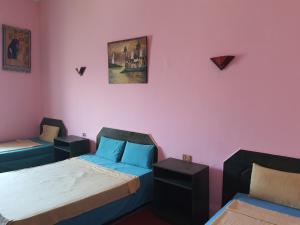 Postel nebo postele na pokoji v ubytování African House Hostel