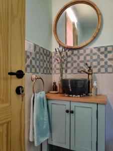 a bathroom with a sink and a mirror at Love Frequency - יורט קסום במתת in Mattat
