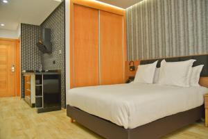 Postel nebo postele na pokoji v ubytování Surf One Hotel
