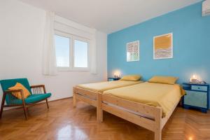 Un pat sau paturi într-o cameră la Nona Mileva Apartment