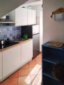 Η κουζίνα ή μικρή κουζίνα στο Appartamento in centro su strada privata