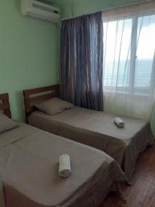 Postel nebo postele na pokoji v ubytování Hotel Premium