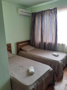 Postel nebo postele na pokoji v ubytování Hotel Premium