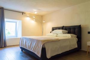 Posteľ alebo postele v izbe v ubytovaní Tesoro Nascosto B&B