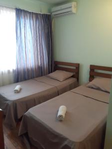 Postel nebo postele na pokoji v ubytování Hotel Premium
