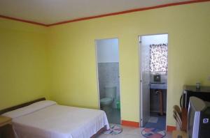 Postel nebo postele na pokoji v ubytování M&E Guesthouse