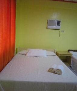 Postel nebo postele na pokoji v ubytování M&E Guesthouse