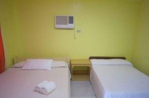 Postel nebo postele na pokoji v ubytování M&E Guesthouse