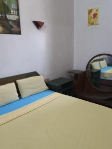 Postel nebo postele na pokoji v ubytování African House Hostel